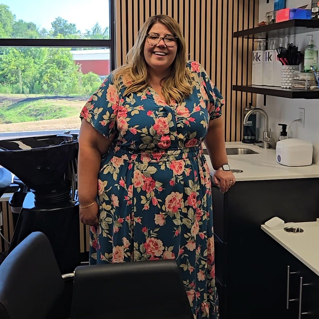 Beauty professional standing in her salon suite at The Hive Florence